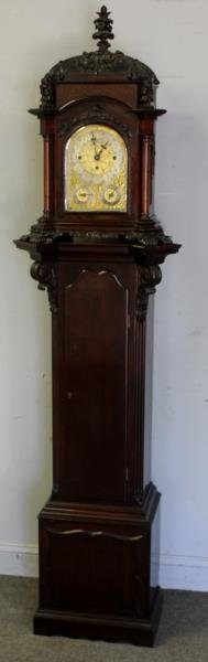 Impressive & Rare Finely Carved Theodore B Starr: Musical Bracket Clock on Stand. From a White Plains, NY home. Dimensions: Clock 29" h x 17" w x 12" d and stand 52" h. Total height 81." Condition: Excellent with original patina.