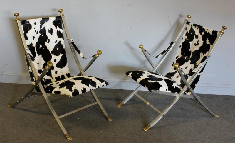 Pair Quality Midcentury Steel and Brass: Folding Campaign Style Arm Chairs. Unmarked but Maison Charles quality. From a Westchester, NY location. Dimensions: 24.5" w. Condition: Couple arm straps need attention.