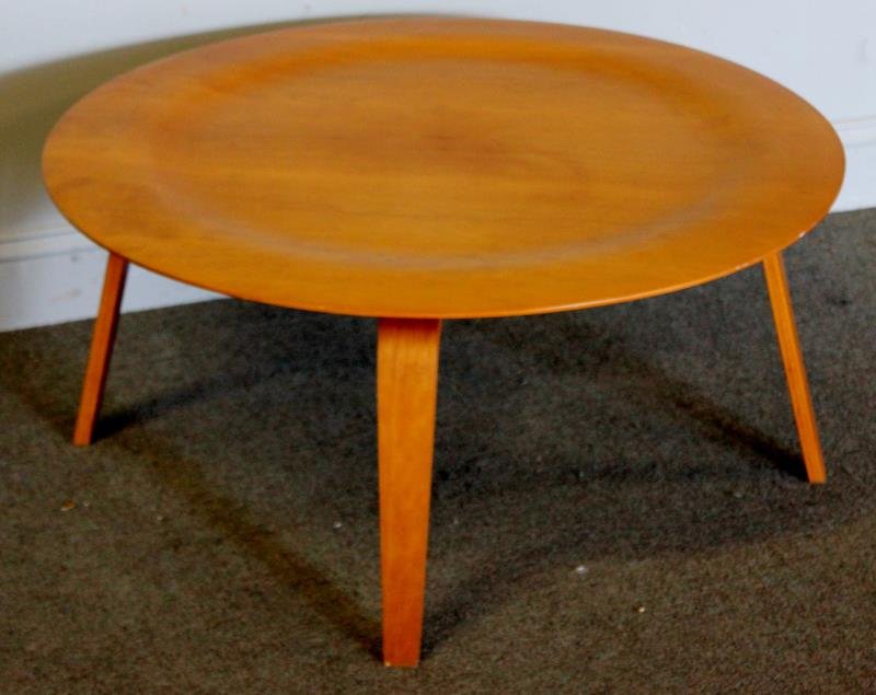 Charles & Ray Eames for Herman Miller CTW Table.: Contemporary / Later Production. Labeled Eames. Molded plywood round coffee table. From a New Canaan, CT estate. Dimensions: 34" diameter x 15.5" h. Condition: Very Good.