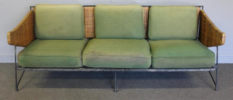Midcentury Maurizio Tempestini for Salterini Sofa.: Iron and rattan / wicker three seat sofa with upholstered cusions. Mesh seats and x back frame in iron. Unmarked. From a New Canaan, CT estate. Dimensions: 79" w x27" d x 30" h. Condition: One leg loo