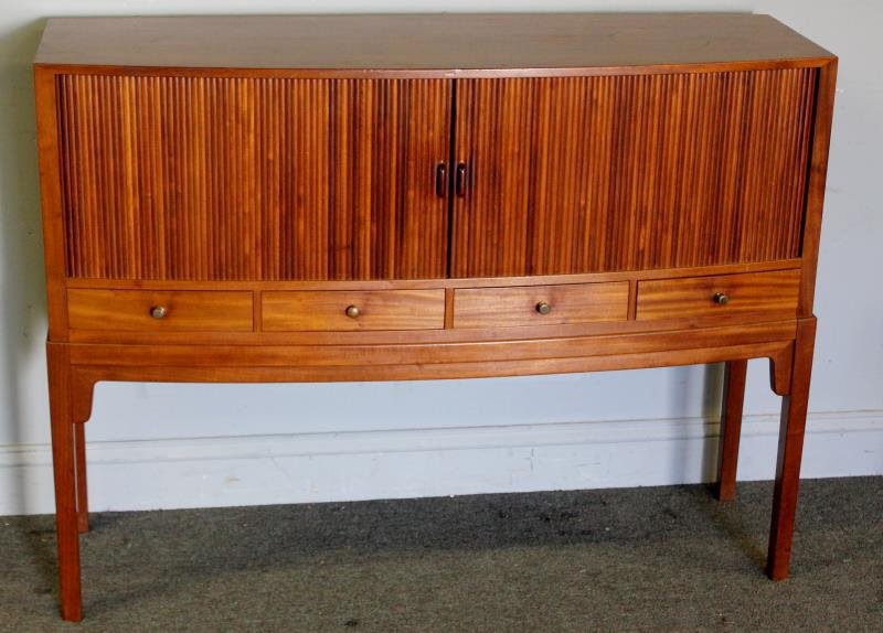 Midcentury Borge Mogensen Tambour Front Server.: Narrow demilune server with tambour doors over drawers and interior tray adjustable shelf. Labeled to reverse. From a New Canaan, CT estate. Dimensions: 47" w x 15" d x 35.5' h. Condition: Good.