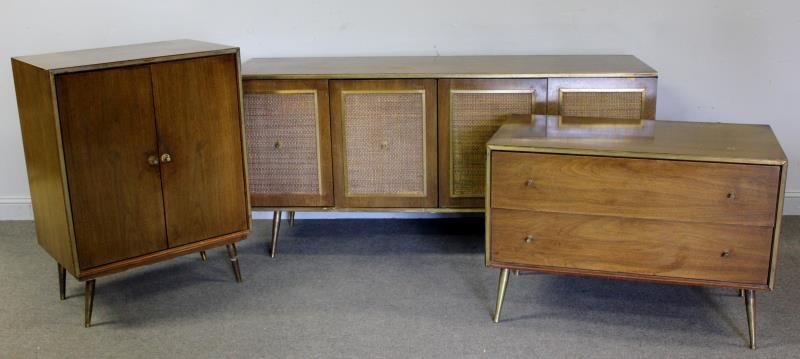 Midcentury 3 Piece Lot Including 2 Drawer Chest.: With brass trim raised on brass feet, a 2 door cabinet with brass trim, and a 4 door cabinet with cane doors and raised on brass feet. 2 door cabinet with interior drawers and labeled Jack Jones Furni