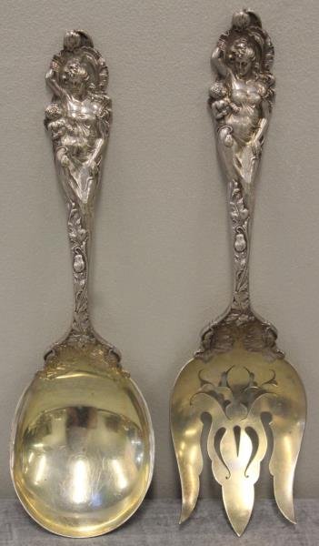 STERLING. Reed & Barton "Love Disarmed" Salad Set.: Handle of serving pieces beautifully depict Venus and cupid. Total approx. weight is 13.96 troy oz. From a Darien, CT estate. Dimensions: serving fork - 10.875" in length; serving spoon - 10.375" in l