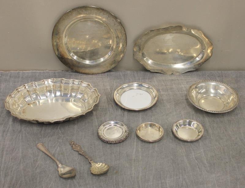 STERLING. Miscellaneous Hollow Ware Grouping.: Includes a silver rimmed wine coaster, a Whiting spoon, a Gorham spoon, 2 sterling nut dishes, 6 monogrammed Whiting nut dishes with scalloped edges; a small sterling bowl, a Frank Smith Silver Co. sc