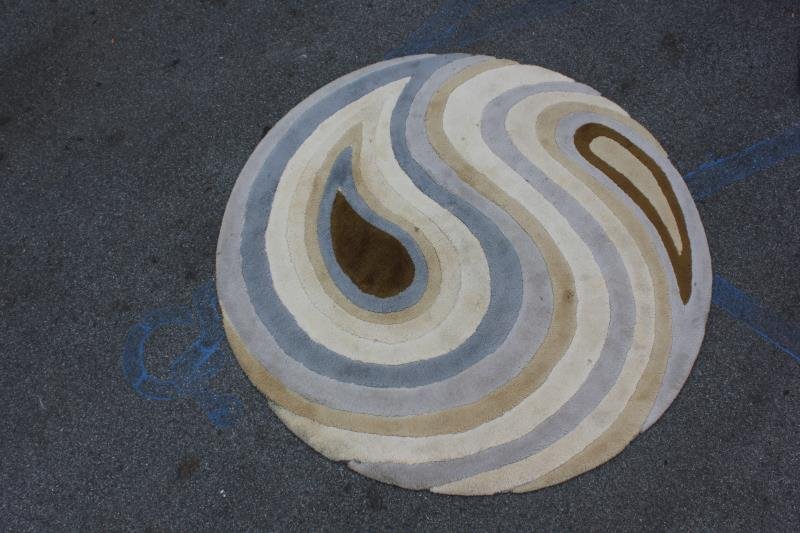 Midcentury Edward Fields Abstract Area Rug.: Labeled to reverse. From a Queens, NY estate. Dimensions: 6' diameter. Condition: Good, needs cleaning.