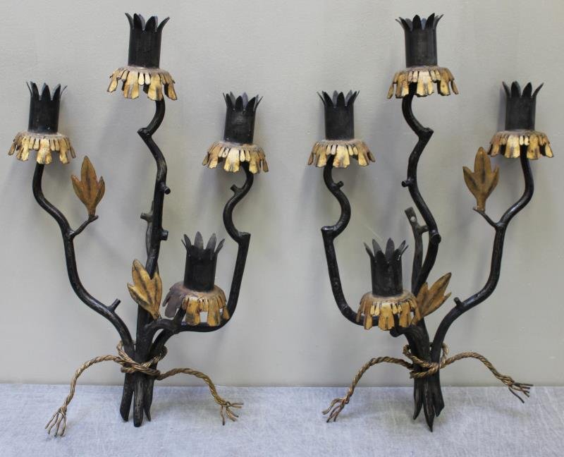 Pair of 1940's French Wrought Iron Sconces.: In the style of, and possibly by Gilbert Poillerat. Wrought iron sconces with parcel gilding. From a Manhattan, NY location. Dimensions: 16" w x 8.125" d x 27" h. Condition: Good, original condition.