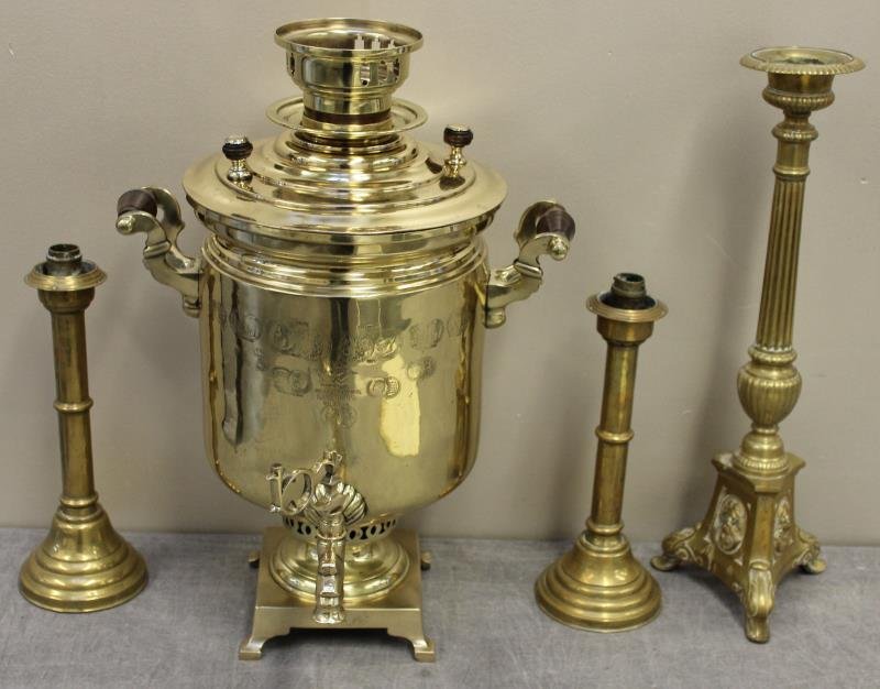 Antique Russian Brass Lot.: Includes a heavily stamped and dated Samovar, a pair of signed candlesticks, and an altar candlestick. From a Norwalk, CT estate. Dimensions: samovar - 14" w x 20.5" h. Condition: Samovar with spigot 
