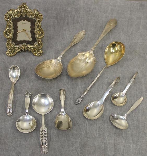 STERLING. Miscellaneous Flatware Including Jensen.: Includes a gilded Gorham easel back clock, a Gorham sterling spoon, a Whiting sterling spoon, an .875 silver spoon with gilded bowl, a David Anderson spoon, and a collection of 6 Georg Jensen spoons. 