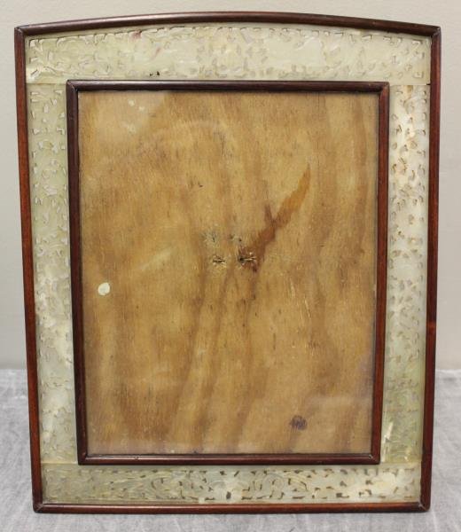 Antique/Vintage Chinese Jade and Hardwood Easel: Back Photo Frame. Reticulated border with foo dogs and a butterfly. From a Rye, NY home. Dimensions: overall - 11.25" w x 13.675" h, photo size - 7" w x 10" h. Condition: Good.