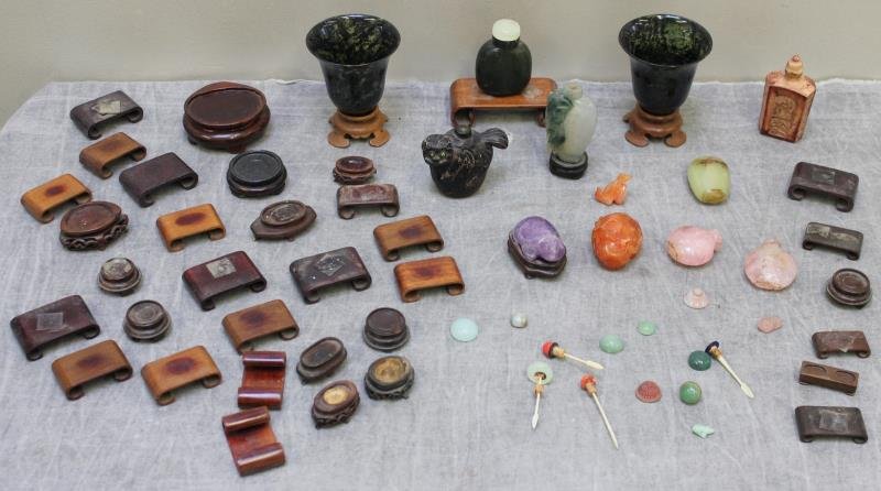 Antique/Vintage Chinese Hardstone Lot.: Includes a pair of spinach jade cups on stands, jade, carnelian, amethyst, soapstone snuff bottles, a wood foo dog snuff bottle, an assortment of mismatched lids, and an assortment of bases. From a Ne