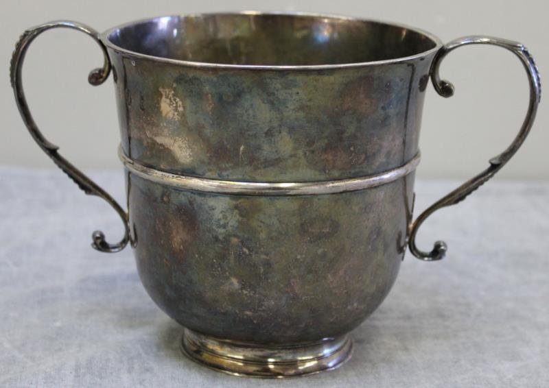 SILVER. Antique English Handled Pedestal Cup.: Probably early 18th century, with city marks, and an unidentified maker's mark of CO? Inscription to bottom, "R.A. Jun". Total approx. weight is 12.07 troy oz. From a Stamford, CT home. Dimensions: 5"