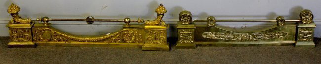 2 Antique / Vintage Fireplace Chenet.: One with center lions head and end cornucopia design. Other with neoclassical design. From a Rye, NY estate.