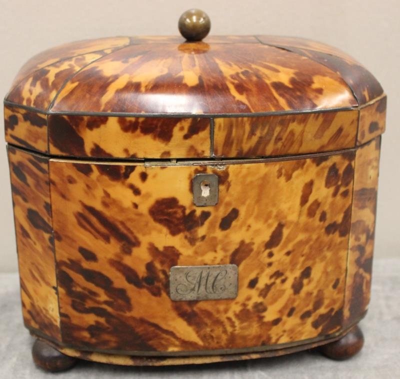 Antique Tortoise Tea Caddy with Silver Inlay.: A nice, probably Regency, bow front and dome top caddy raised on bunn feet. From a Harrison, NY home. Dimensions: 7" w x 4.25" d x 6" h.