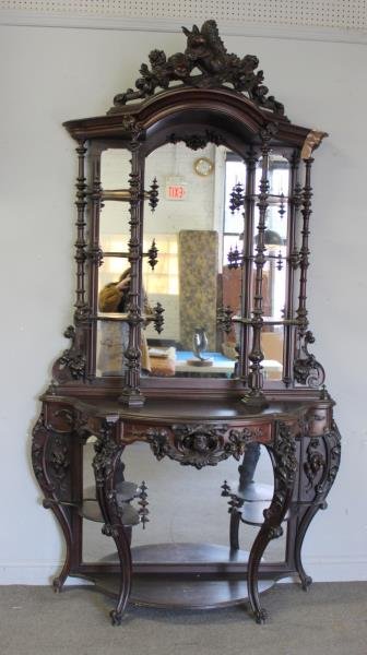 Outstanding Victorian Rosewood Etagere.: Magnificent with mirrored back, carved all over with flowers and a bird, with a squirrel eating a nut in foliage on the crown. From an East Hampton, NY estate. Dimensions: 55.5" w x 24.5" d x 103" h.