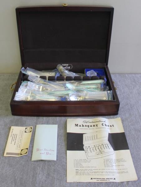 STERLING. Westmorland "Lady Hilton" Flatware Set.: Circa 1940. Includes 12 butter knives, 12 soup spoons, 12 dinner knives, 12 dinner forks, 12 salad forks, 12 teaspoons, a large tablespoon, a master butter knife, 2 serving spoons, and a gravy ladle. 