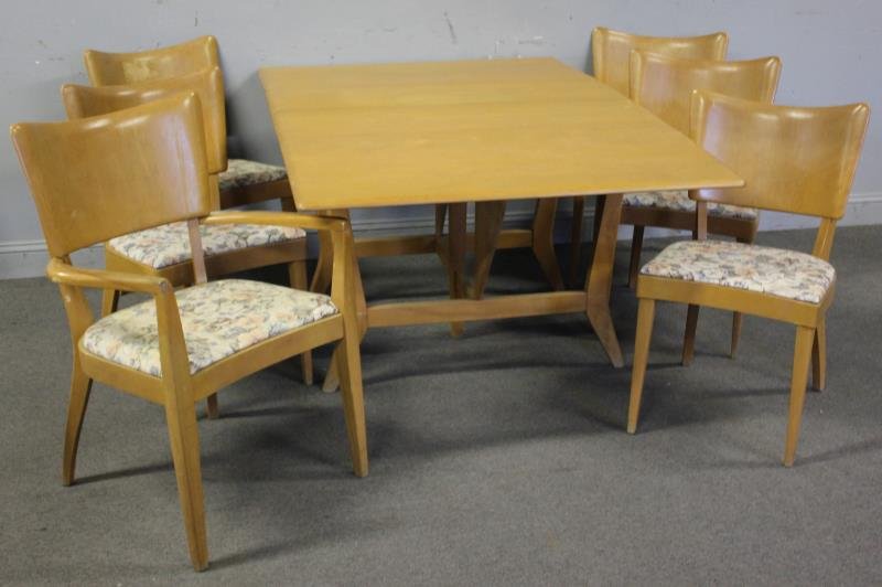 Midcentury Heywood-Wakefield Dining Set.: Clean set Labeled with manufacturers and retailers tags. 5 side chairs and single arm chair. Drop leaf table. 2 10" leaves. From a Massapequa, NY estate. Dimensions: Table - 66" w x 42" d x 28" h; Sid