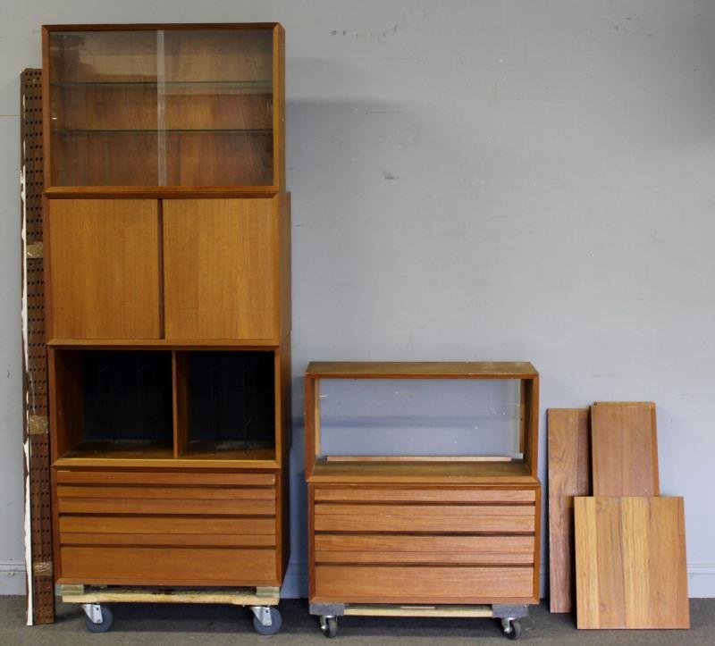 Midcentury Danish Teak Wall Unit.: Includes 6 cabinets, 3 shelves, and multiple bays. One cabinet with glass front sliding doors and nice original shelves with rolled edges. Marked Made in Denmark to reverse of several cabinets. From a