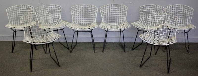 Set of 8 Harry Bertoia for Knoll Wire Chairs.: All 8 with black painted bases. From a Larchmont, NY estate. Dimensions: 23"w x 16" d x 29" h. Condition: Outdoor use condition, with losses.
