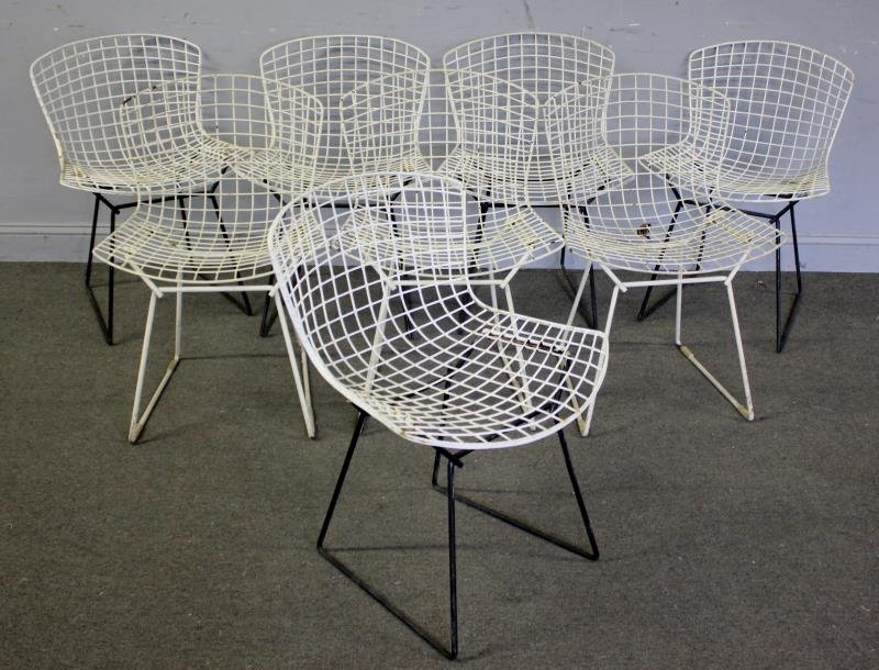 8 Harry Bertoia for Knoll Wire Chairs.: 5 with black painted bases, 3 all white frames. Unmarked. From a Larchmont, NY estate. Dimensions: 23" w x 16"d x 29" h. Condition: Outdoor use condition with losses.