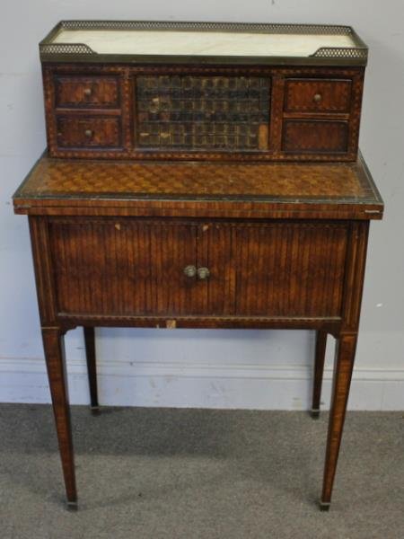 18th Century Continental Marble Top Secretary.: An unusual model with leather book binding, tambour top and tambour bottom with fitted interior. From a White Plains, NY estate. Dimensions: 25.5" w x 16.5" d x 39" h. Condition: Marble with hairline,
