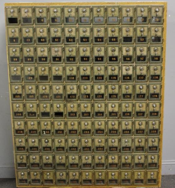 2 Antique Bronze Front Post Office Style: Cubbies. Great decorator statement pieces. List of box combinations included. From a Bronxville, NY home. Dimensions: 41.25" w x 14.5" d x 51.5"h and 67.5" w x 14.5" d x 51.5" h. Condition: Some missi