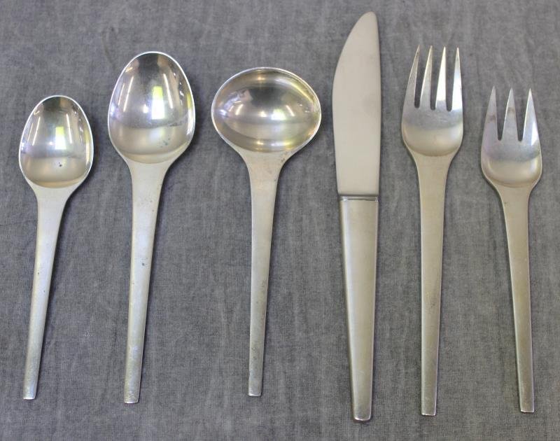 STERLING. Georg Jensen "Caravel" Partial Flatware: Set. "Caravel" pattern designed by Henning Koppel, circa 1957. Includes 2 dinner knives, 2 soup spoons, 5 teaspoons, 2 tablespoons, 2 luncheon forks, and 2 dinner forks. Total approx. weight is 20.1 t