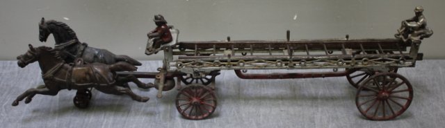 Antique Cast Iron Ives Toy Ladder Truck.: With figure and 1 ladder. From a New Rochelle, NY estate. Condition: Worn original paint, missing ladders. Dimensions: 28.5" long.