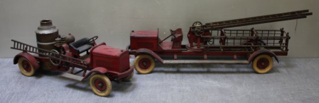 Kingsbury Steel Fire Trucks.: Includes a pumper and a ladder truck. From a New Rochelle, NY estate. Dimensions: 23.5" and 30" long. Condition: Pumper truck missing ladder, other truck missing figure, both original paint with areas