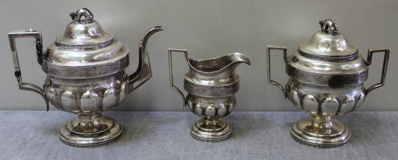 SILVER. Antique American William Thomson Tea Set.: Beautiful 3 piece coin silver tea set including a teapot, creamer and sugar with fox hunting vignettes, and mythical fish form finials. Stamped, "W Thomson" signifying William Thomson, New York, early