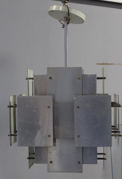 Midcentury Robert Sonneman Chandelier.: Stainless steel plate fixture. With canopy. From a 72nd Street, NYC estate. Dimensions: 15.25" w x 13" d x 26" h to canopy. Condition: Needs cleaning / polish. Canopy with oxidation, some plates with