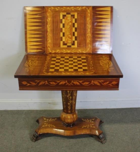 19th Cent Continental Marquetry Inlaid Game Table.: Fine quality, inlaid all over with games on flipside. From a Briarcliff Manor, NY home . Dimensions: 30" w x 16.5" d x 29" h & 33"open Condition: good.
