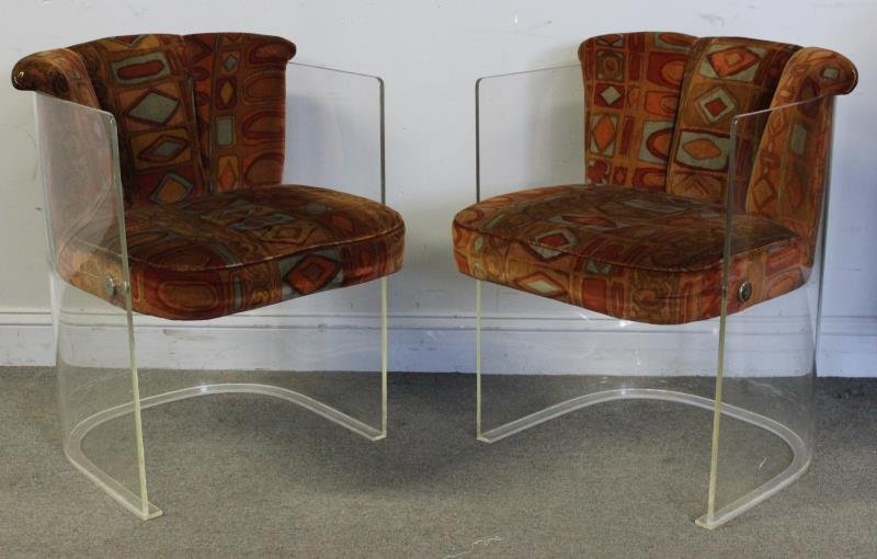 Midcentury Pair of Vladimir Kagan Lucite Barrel: Chairs. Lucite frames and chrome button anchors. Vintage upholstery in the style of and probably Jack Lenor Larsen. From an Englewood, NJ estate. Dimensions: 22" w x 24" d x 29" h. Condition: Good wit