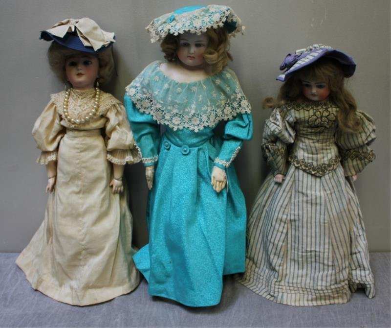 3 Antique / Vintage Bisque Dolls.: From a Hastings-on-Hudson, NY estate. Back from previous sale due to non-payment by bidder Jason Rapoza of Fall River, MA. Dimensions: 21.5" - 23" high. Condition: One with losses to hands (see pictur
