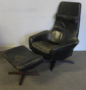 Danish Leather Lounge Chair and Ottoman.: Midcentury lounge chair and ottoman upholstered in black leather with star swivel base. Rubber straps labeled Rotex / Denmark. In the style of and possibly Georg Thams. From a Larchmont, NY home. Dime