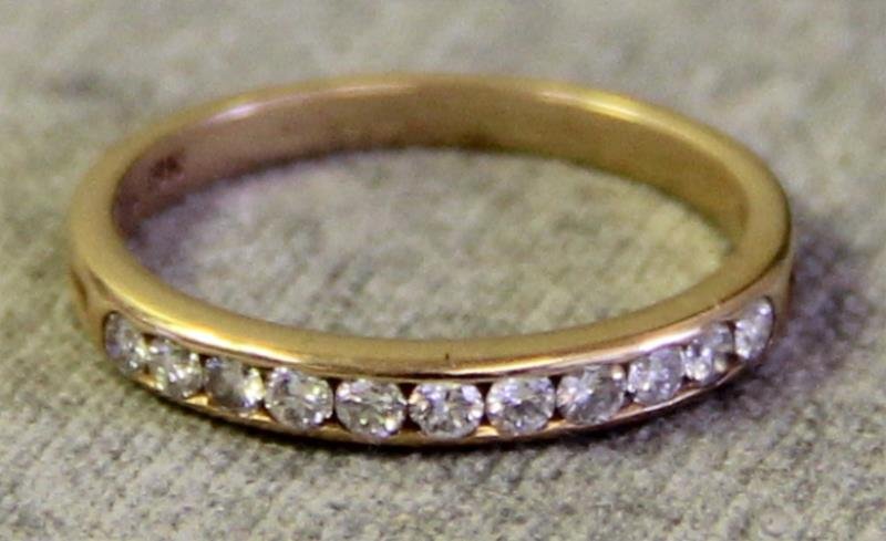JEWELRY. Tiffany & Co. Diamond Wedding Band.: 18kt yellow gold Tiffany & Co. half circle diamond ring. Ring size - 5. Total approx. weight is 1.1 dwt. From an Elmsford, NY estate.