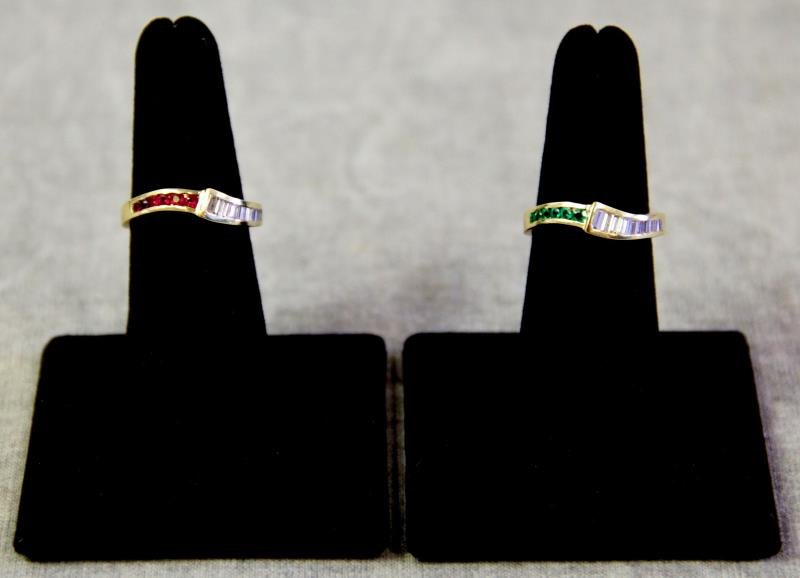 JEWELRY. Near Matched Pair of 18kt Gold & Diamond: Rings. Includes one 18kt yellow gold, ruby and baguette diamond ring, with one 18kt yellow gold, emerald and baguette diamond ring. Can be worn separately, or together in various ways. Ring sizes: 6 3