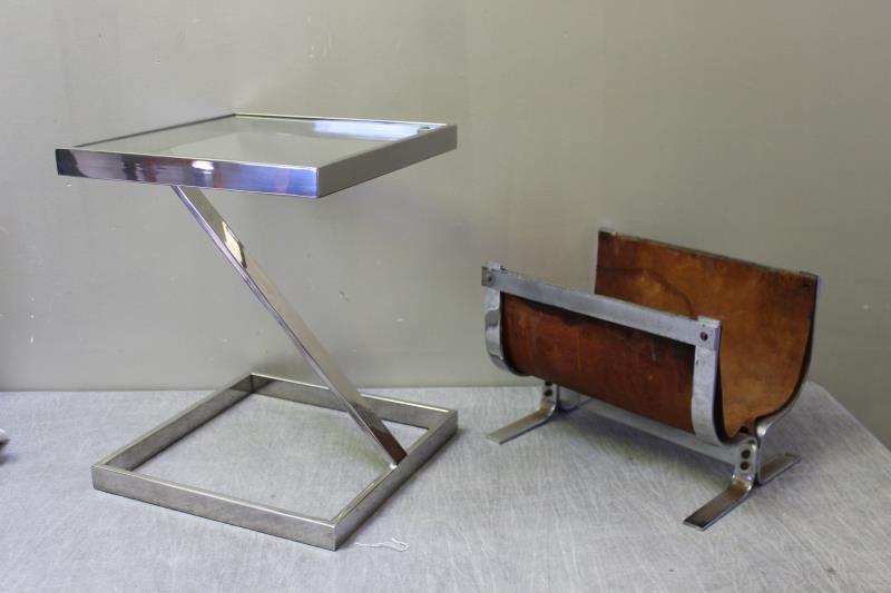 Chrome Lot Including Alessandro Albrizzi: Fire Caddy. Together with a two tier chrome end table with glass insert. . From a Dix Hills, NY estate. Dimensions: Caddy - 16" w x 12" d x 12" h; Table - 16" w x 16" d x 20" h. Condition: Table good.