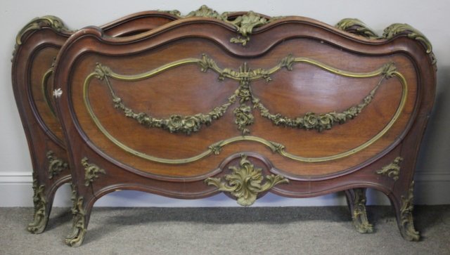 Fine Quality All Over Bronze Mounted Bed / Daybed: Great quality with heavy beonze mounting . Walnut with bronze swag and flower decoration From a New Rochelle estate . Dimensions: 46" W x 28' h Condition: missing bronze shoulder piece