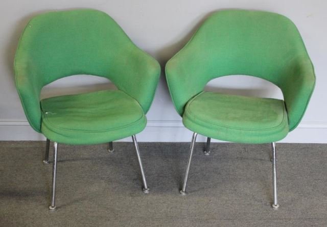 Midcentury Pair of Eero Saarinen Executive Chairs.: Eero Saarinen for Knoll. In green upholstery with aluminum legs. Both with arms. Knoll label. From a Port Chester, NY estate. Dimensions: 25" w x 23" d x 31.5" h. Condition: Good.