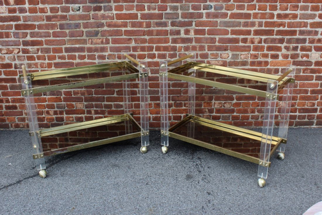 Pair of Midcentury Brass and Lucite Tea Carts.: Mirrored trays with Lucite block joints and brass frames. From a Queens, NY estate. 38" w x 20" d x 32.5" h.
