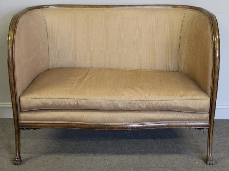 Upholstered Clawfoot Loveseat.: From a Manhattan estate. Dimensions: 50.5" w x 27" d x 36.75" h. Condition: Fading to upholstery.