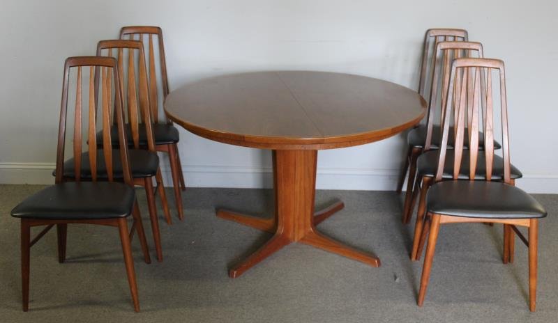 Niels Moller for Koefoeds-Hornslet Dining Set.: Midcentury dining set including a set of 6 Niels Moller Eva side chairs in walnut frame with upholstered seat. Branded Made in Denmark and Koefoeds-Hornslet. Together with a center dining table with o