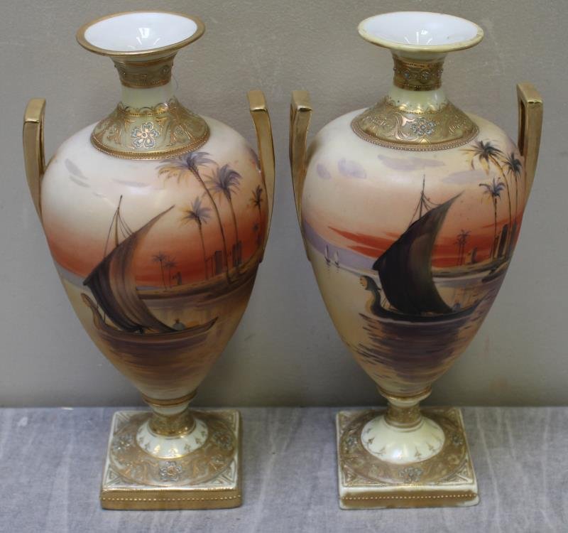 Pair Of Nippon Decorated Porcelain Urns: A rare pair of Urns from a Scarsdale estate. Dimensions: 11"H x 5"W Condition: good