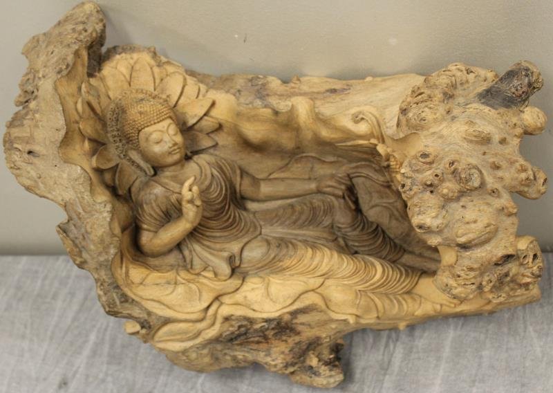 Finely Carved Reclining Quan Yin.: Beautifully carved out of one piece of burl walnut. From a Greenwich, CT estate. Dimensions: 17" long x 10" wide. Condition: good