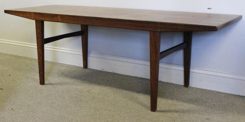 Midcentury Rosewood Coffee Table.: Nice long and high coffee table. Unmarked in the Danish style. From a Long Island, NY estate. Dimensions: 59" w x 20" d x 19.5" h. Condition: Good.