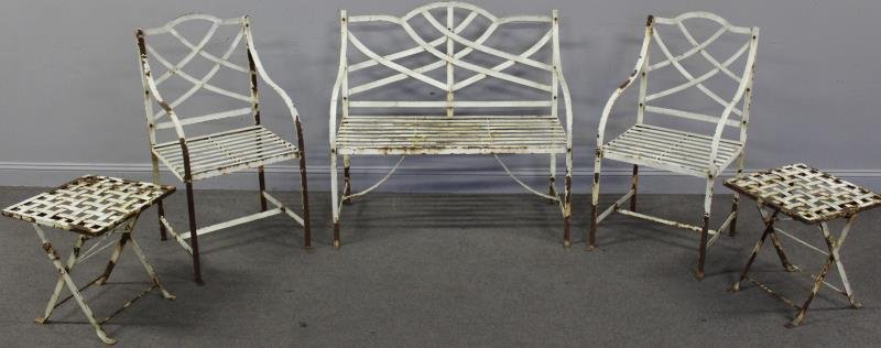 5 Piece Hand Wrought Painted Iron Set.: Includes a settee - 40" w x 19" d x 39" h, a pair of chairs - 39" h x 18" d x 20" w, and a pair of ottomans - 17" x 17" x 19" h. From a New Rochelle, NY home. Condition: Paint losses and rust. One scr