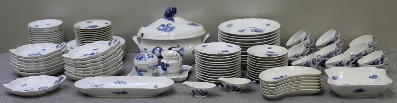 Royal Copenhagen Blue Flower Porcelain Dinner: Service. Includes 11 scalloped plates (6 1/8" d), 12 scalloped plates (6 7/8" d, 3 with chips), 12 bread and butter plates (6 1/4" d, 1 with hairline), 6 dinner plates (10 1/4" d), 13 leaf plates (9.2