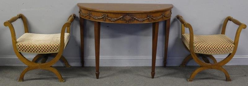 Vintage Furniture Lot To Inc A Carved Demilune: Console Table. Together with a pair of neoclassical style benches. From a Harrison, NY estate. Dimensions: Console table - 44.5" w x 19.5" d x 32" h, Benches - 27" w x 17.5" d x 27" h overall. Conditi