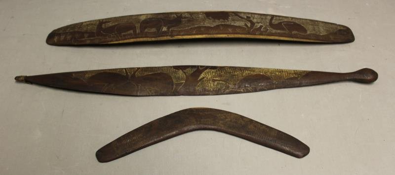 3 Antique Wood Australian Aboriginal Items Including: A Boomerang, a Shield & a spear thrower (Miru / Woomera).Boomerang 15", shield 29" and thrower 30". All beautifully carved and with original patina. From a Norwalk CT estate. Condition: good.