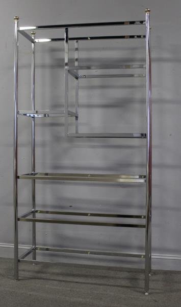 Midcentury Milo Baughman Style Chrome Etagere.: With brass finials and variable height / sized shelves. From a New Jersey estate. Dimensions: 41.5" w x 17" d x 81.5" h Condition: Good.